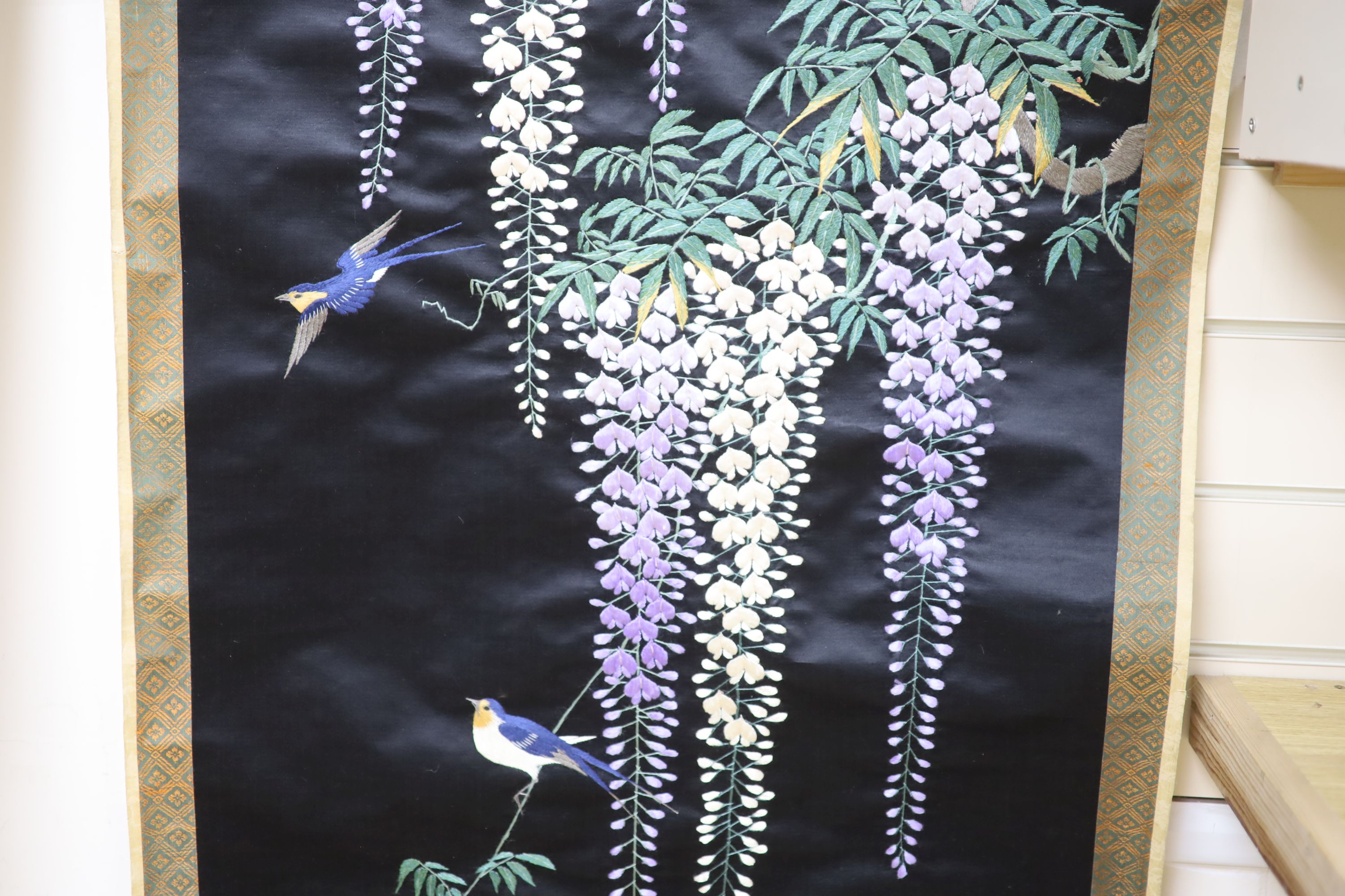 A Japanese embroidered wisteria hanging scroll, overall length 170cm